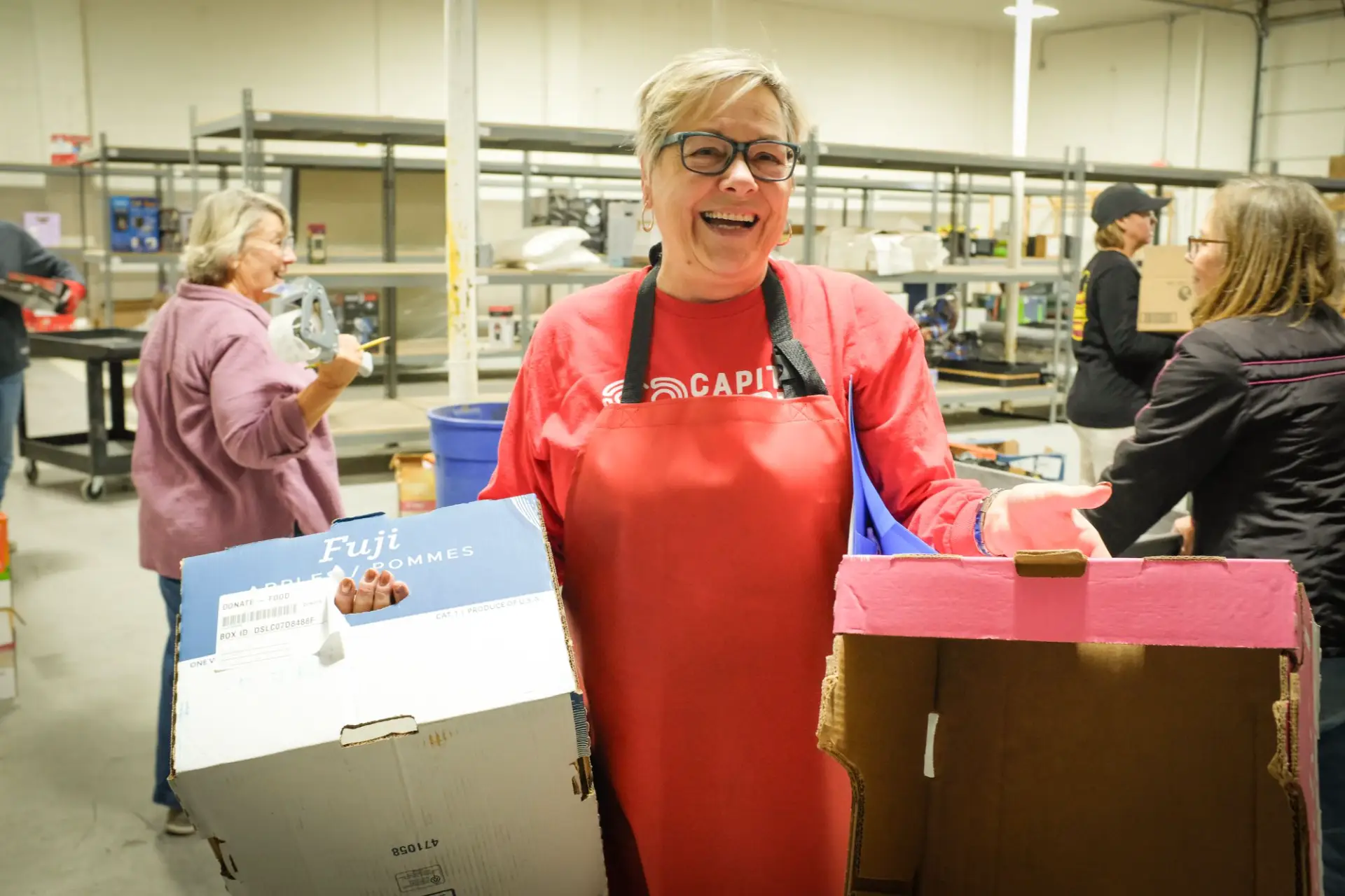 Volunteers working in the Capital Cares warehouse